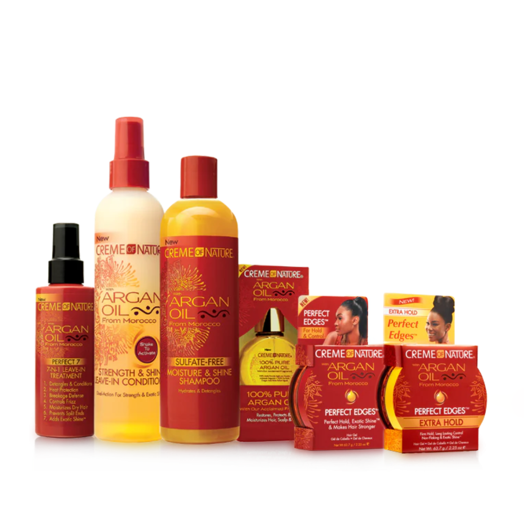 Collection of Creme of Nature Argan Oil hair care products on a white background